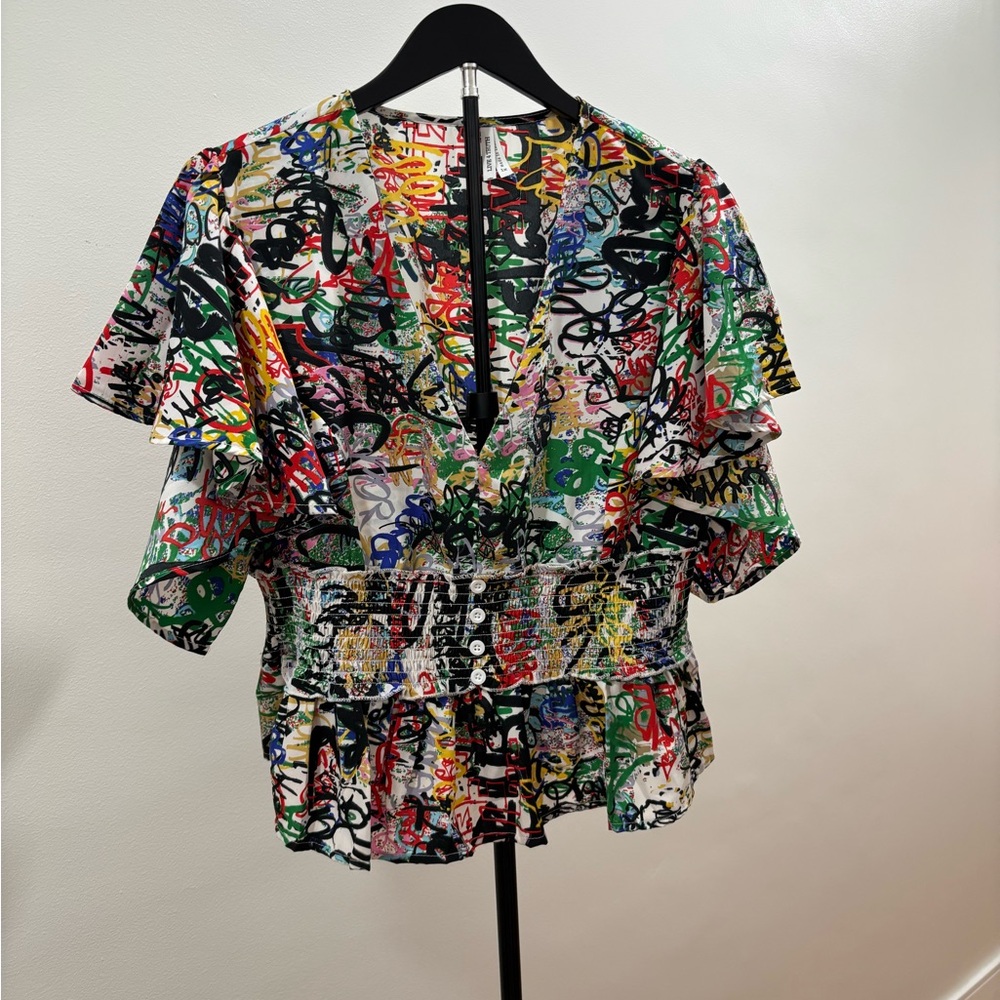 519. Live 4 Truth Multicolor Graffiti-Print V-Neck Blouse W/ Ruffled Sleeves